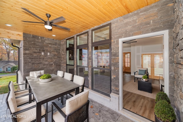 view of patio / terrace with ceiling fan, french doors, and outdoor dining area