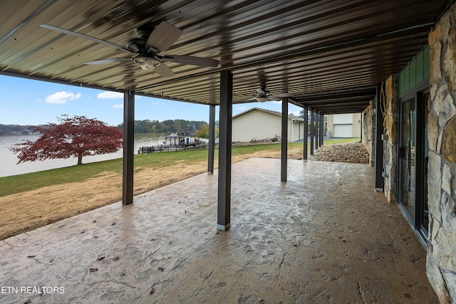 view of patio / terrace with a water view and ceiling fan