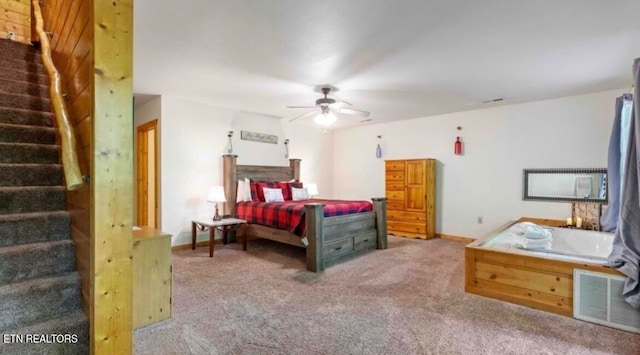 bedroom featuring ceiling fan and carpet floors