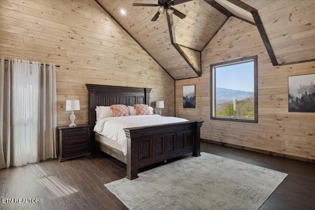 unfurnished bedroom featuring wood walls, hardwood / wood-style floors, and ceiling fan