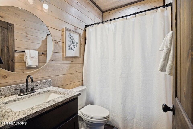 bathroom with walk in shower, wooden walls, toilet, and vanity