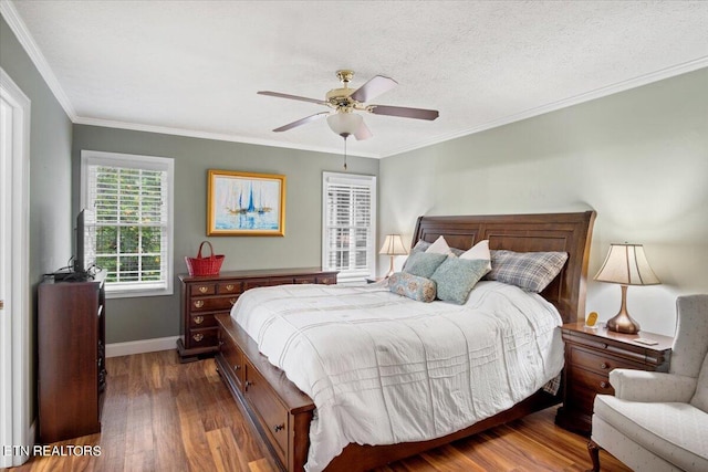 bedroom featuring a textured ceiling, ceiling fan, ornamental molding, and dark wood-type flooring