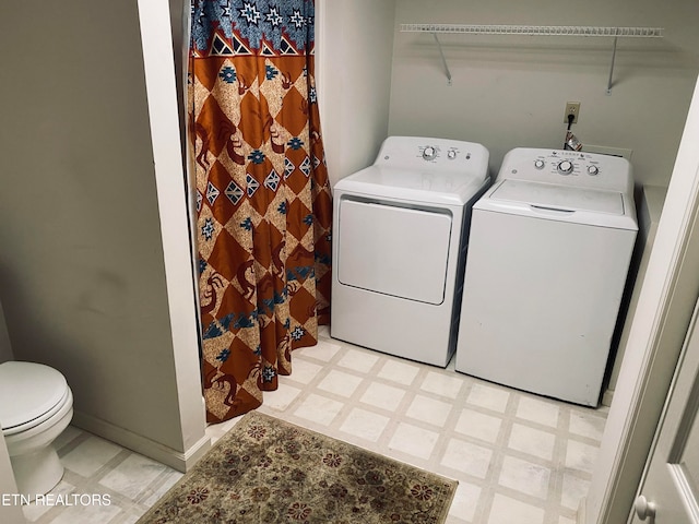 clothes washing area featuring washer and dryer