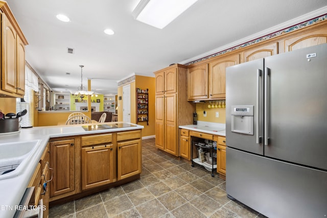 kitchen with black electric stovetop, stainless steel fridge with ice dispenser, sink, hanging light fixtures, and an inviting chandelier