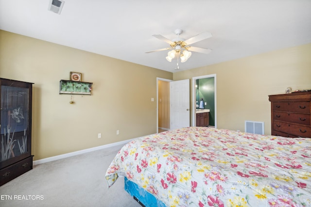 carpeted bedroom featuring ceiling fan and connected bathroom