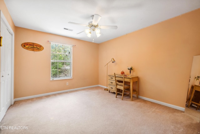 office with carpet flooring and ceiling fan