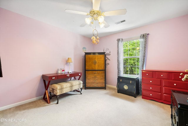 bedroom with ceiling fan and light carpet