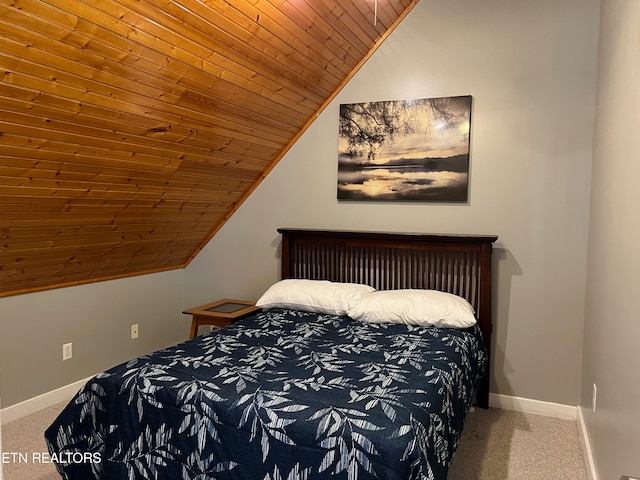 carpeted bedroom featuring wooden ceiling and vaulted ceiling