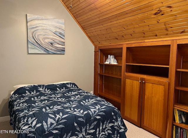 carpeted bedroom featuring wood ceiling and vaulted ceiling