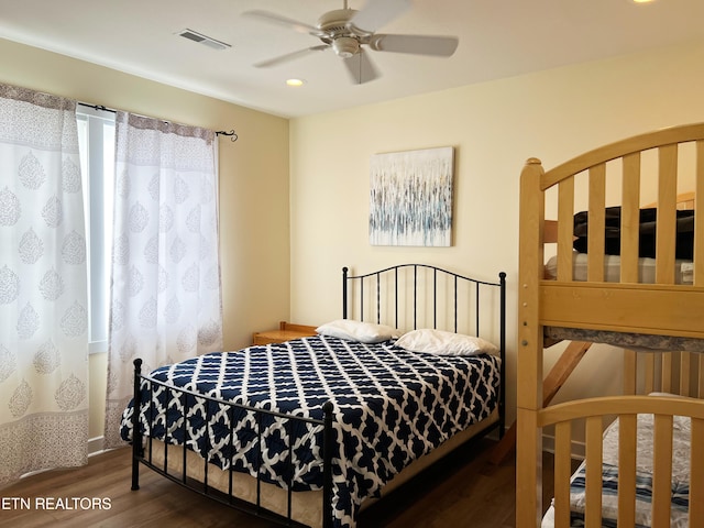 bedroom with dark wood-type flooring and ceiling fan