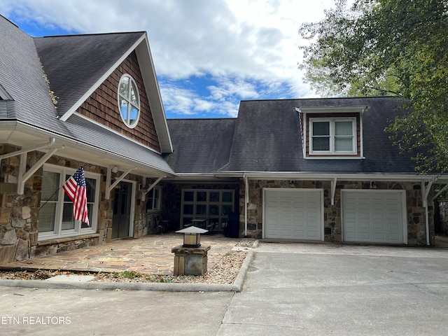 view of front of property featuring a garage