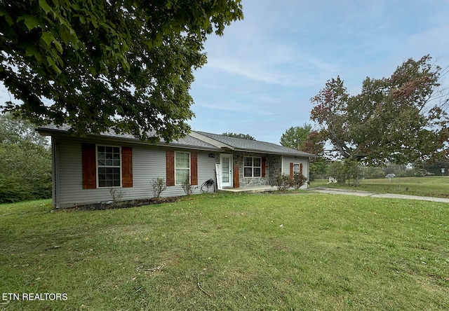 ranch-style house with a front lawn