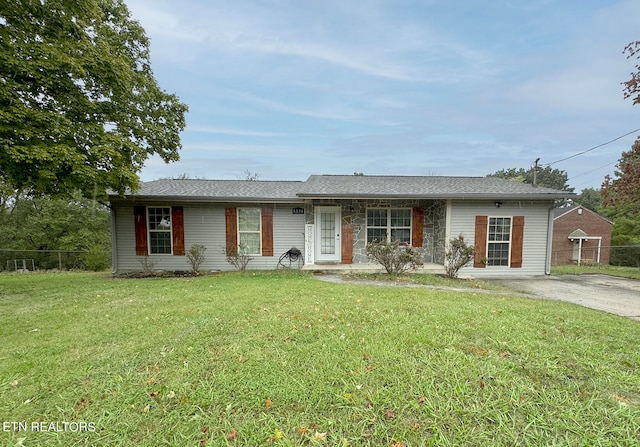 ranch-style home with a front lawn