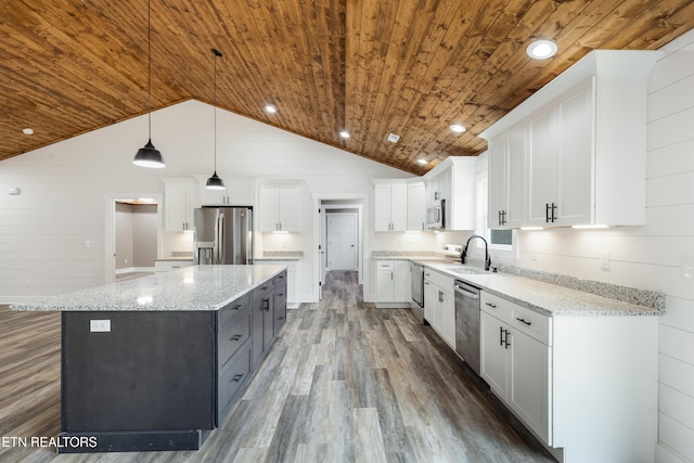 kitchen featuring appliances with stainless steel finishes, wooden ceiling, white cabinetry, and a kitchen island