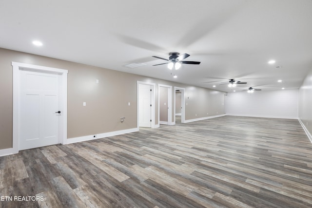 unfurnished room featuring hardwood / wood-style floors and ceiling fan