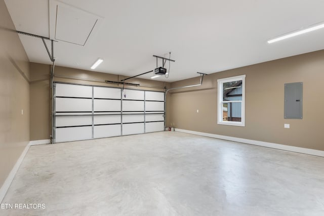 garage with a garage door opener and electric panel