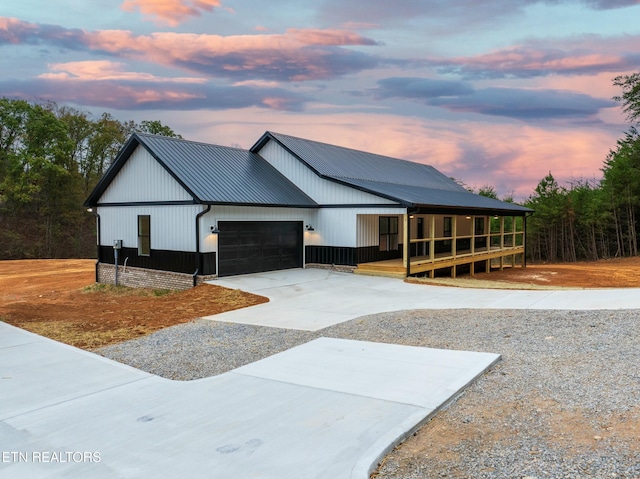 modern inspired farmhouse with a garage