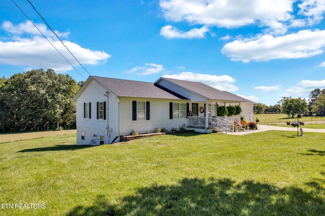 single story home featuring a front yard and a porch