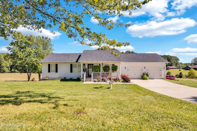 ranch-style home with a front yard, a porch, and a garage