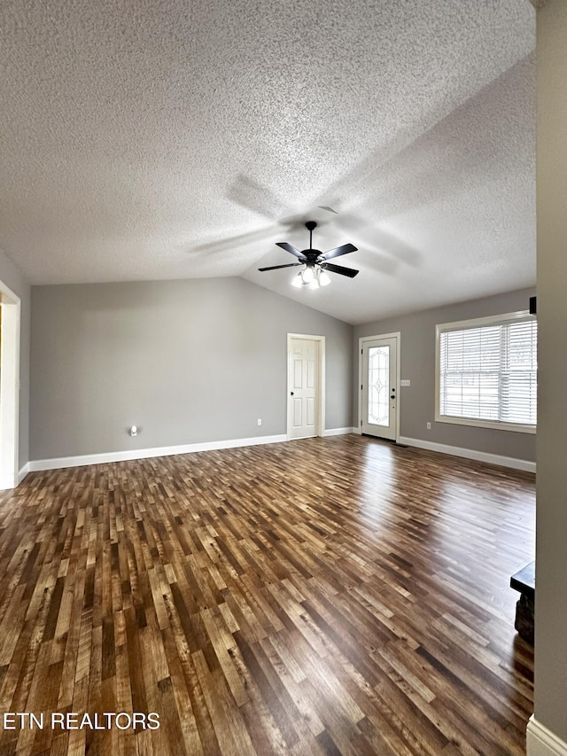 unfurnished living room featuring a textured ceiling, ceiling fan, dark hardwood / wood-style floors, and lofted ceiling