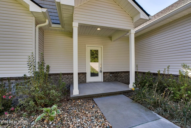 doorway to property featuring a patio area