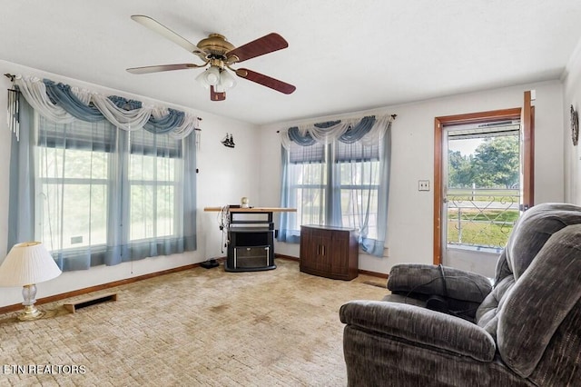 interior space featuring ceiling fan and carpet floors