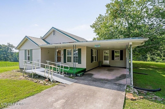 view of front of house with a porch, a front lawn, and a carport