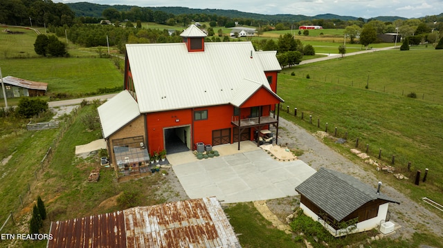 bird's eye view featuring a mountain view and a rural view