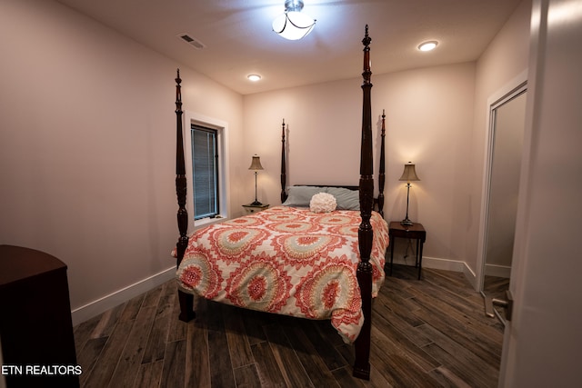 bedroom featuring dark wood-type flooring