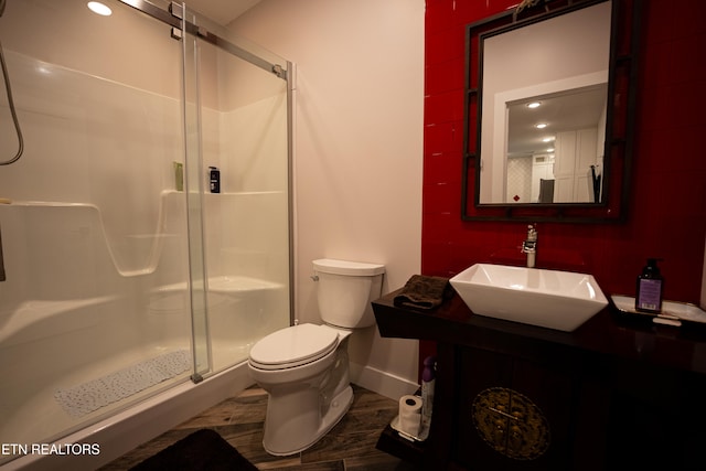 bathroom with vanity, toilet, and walk in shower