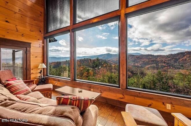 sunroom / solarium with a mountain view