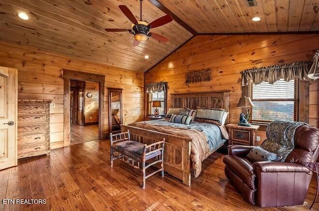 bedroom with hardwood / wood-style floors, wooden walls, lofted ceiling, and wood ceiling