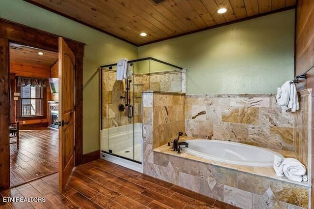 bathroom with wood ceiling, crown molding, and plus walk in shower