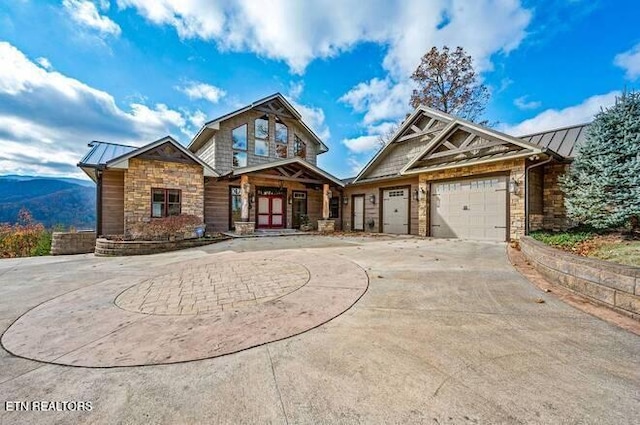 craftsman-style home featuring a mountain view and a garage