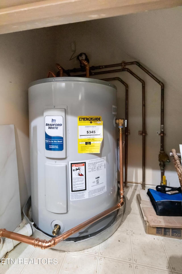 utility room featuring water heater