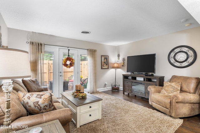 living room with dark hardwood / wood-style flooring