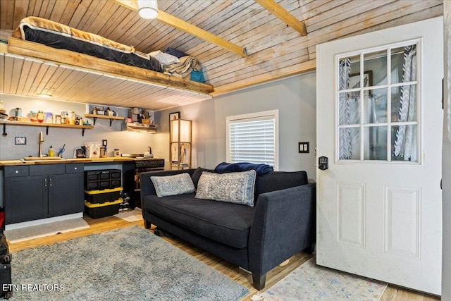 living room featuring wood ceiling, light wood-type flooring, and beamed ceiling