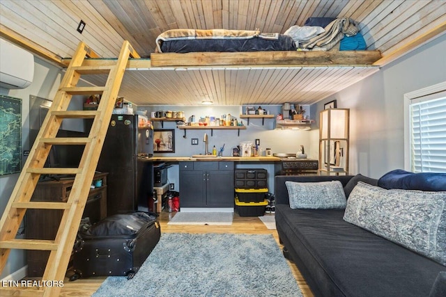 interior space featuring wood ceiling, light hardwood / wood-style floors, sink, beam ceiling, and a wall mounted air conditioner