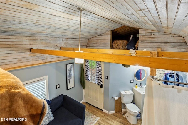 bathroom featuring lofted ceiling, wooden walls, hardwood / wood-style floors, wooden ceiling, and toilet