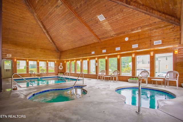 view of swimming pool featuring an indoor hot tub and a patio