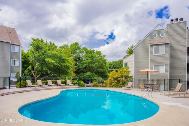 view of swimming pool featuring a patio