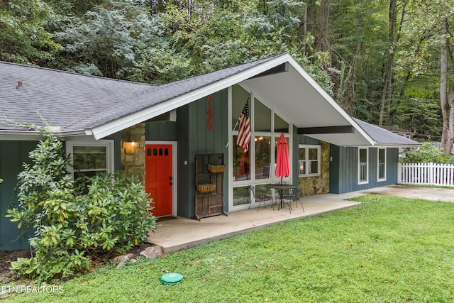 view of outdoor structure featuring a lawn