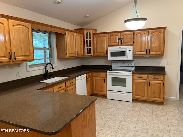 kitchen with light tile patterned flooring, pendant lighting, sink, vaulted ceiling, and white appliances