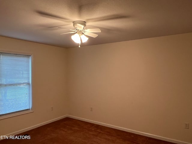 spare room with ceiling fan