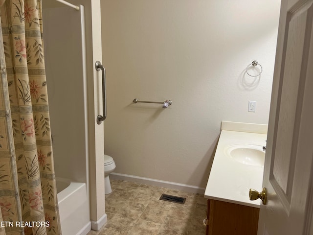 full bathroom featuring vanity, toilet, and shower / tub combo with curtain