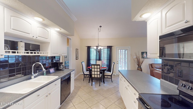 kitchen with hanging light fixtures, black appliances, white cabinetry, and decorative backsplash