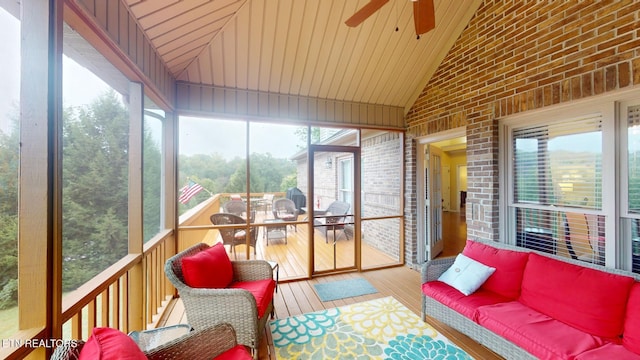 sunroom / solarium featuring wooden ceiling, vaulted ceiling, and ceiling fan