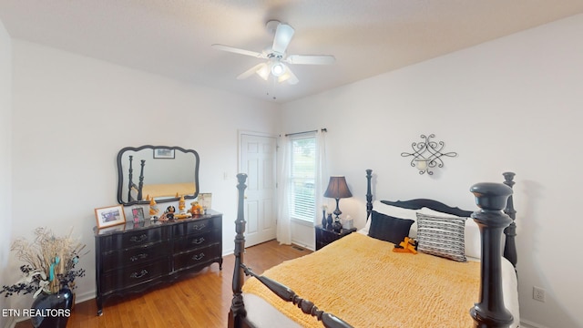 bedroom with wood-type flooring and ceiling fan