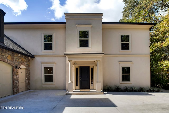 view of front of home with a garage