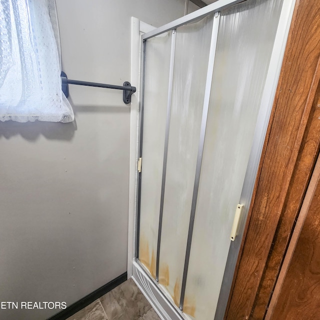 bathroom featuring walk in shower